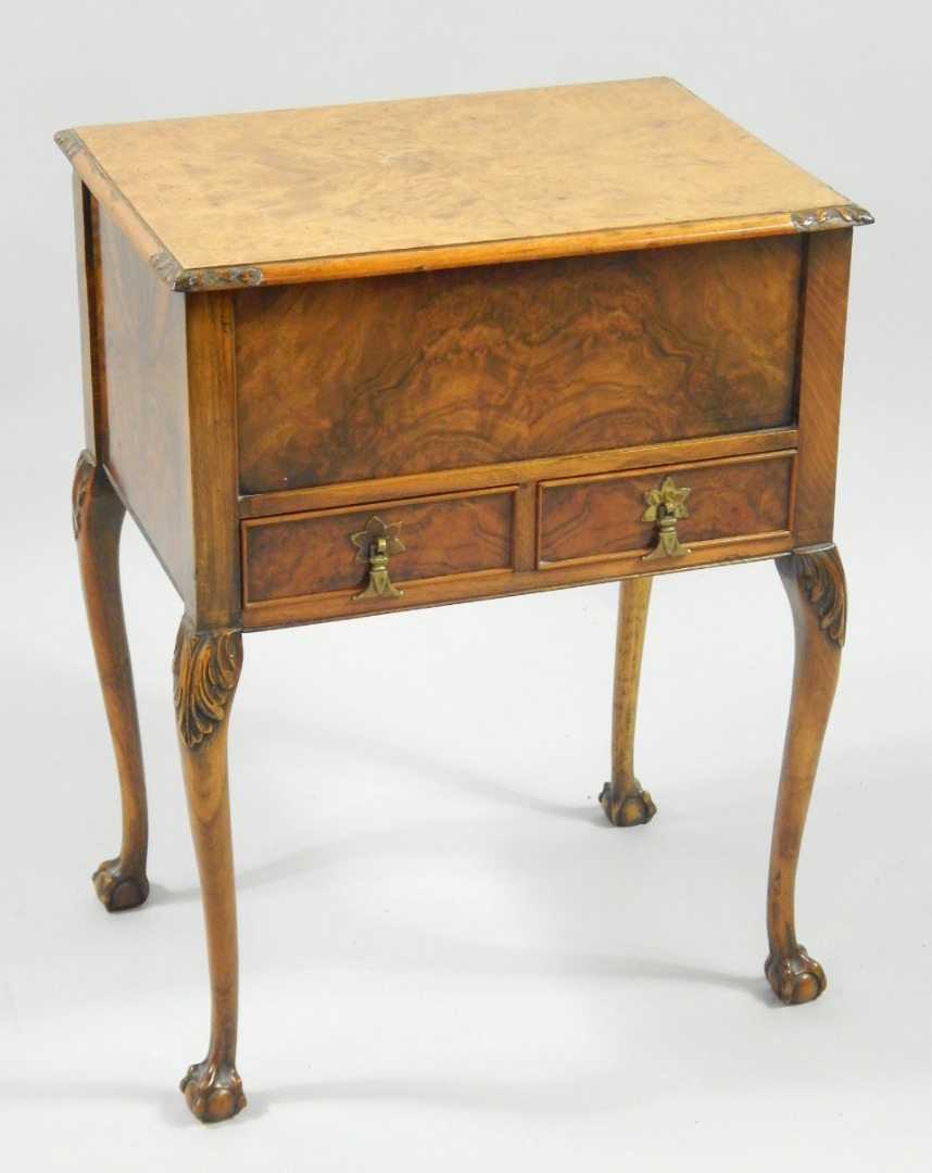 Appraisal: An Inglesants walnut sewing table the quarter veneered lid opening