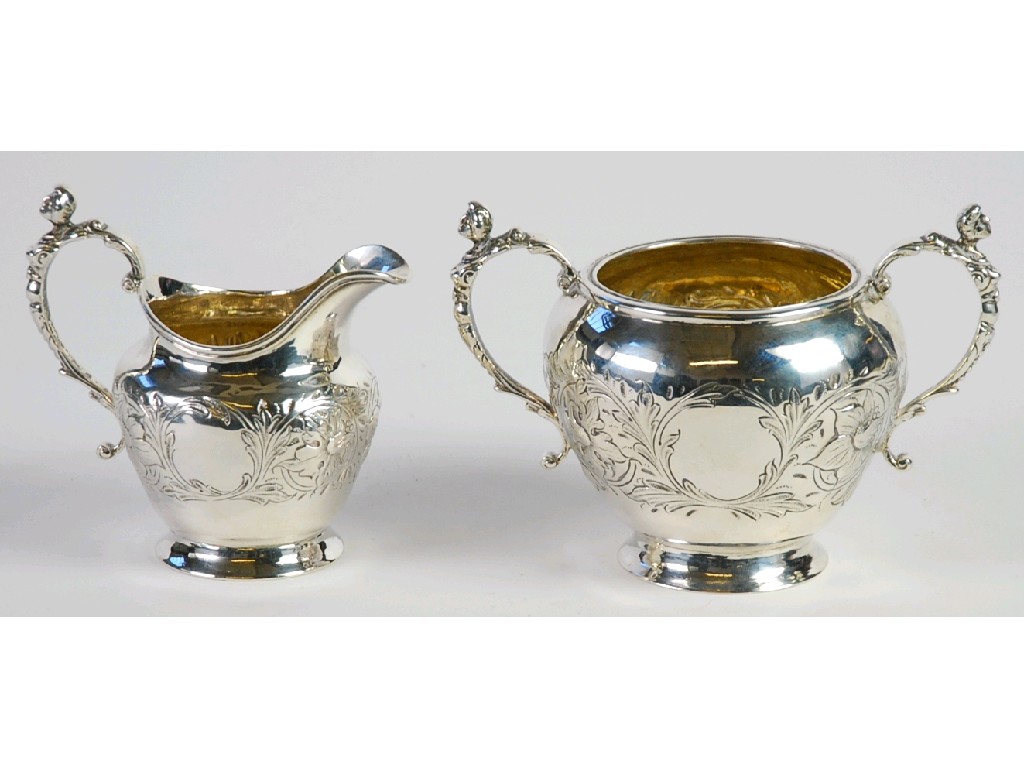 Appraisal: GEORGE III SILVER CREAM JUG AND A MATCHING VICTORIAN TWO