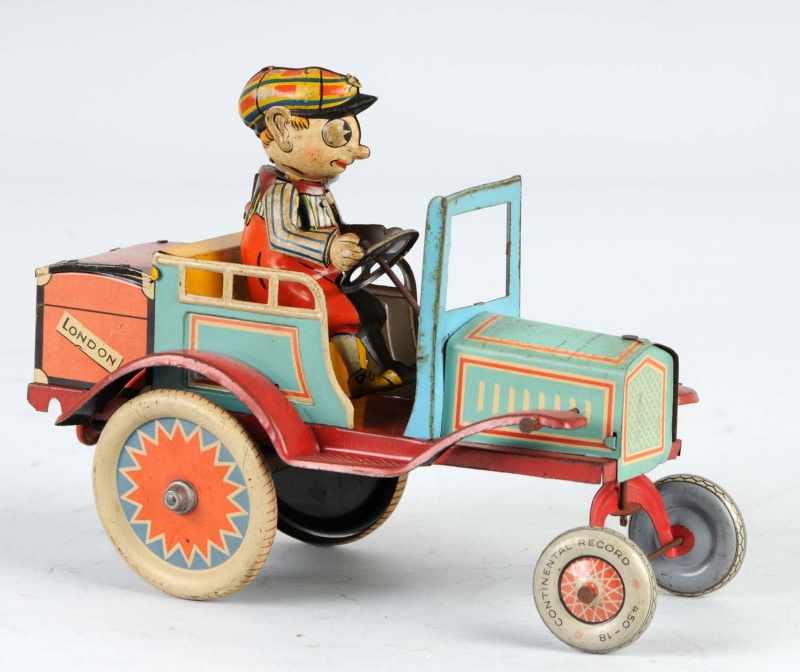 Appraisal: Tin Whoopee Car Wind-Up Toy Description German Pre-war Working Nice