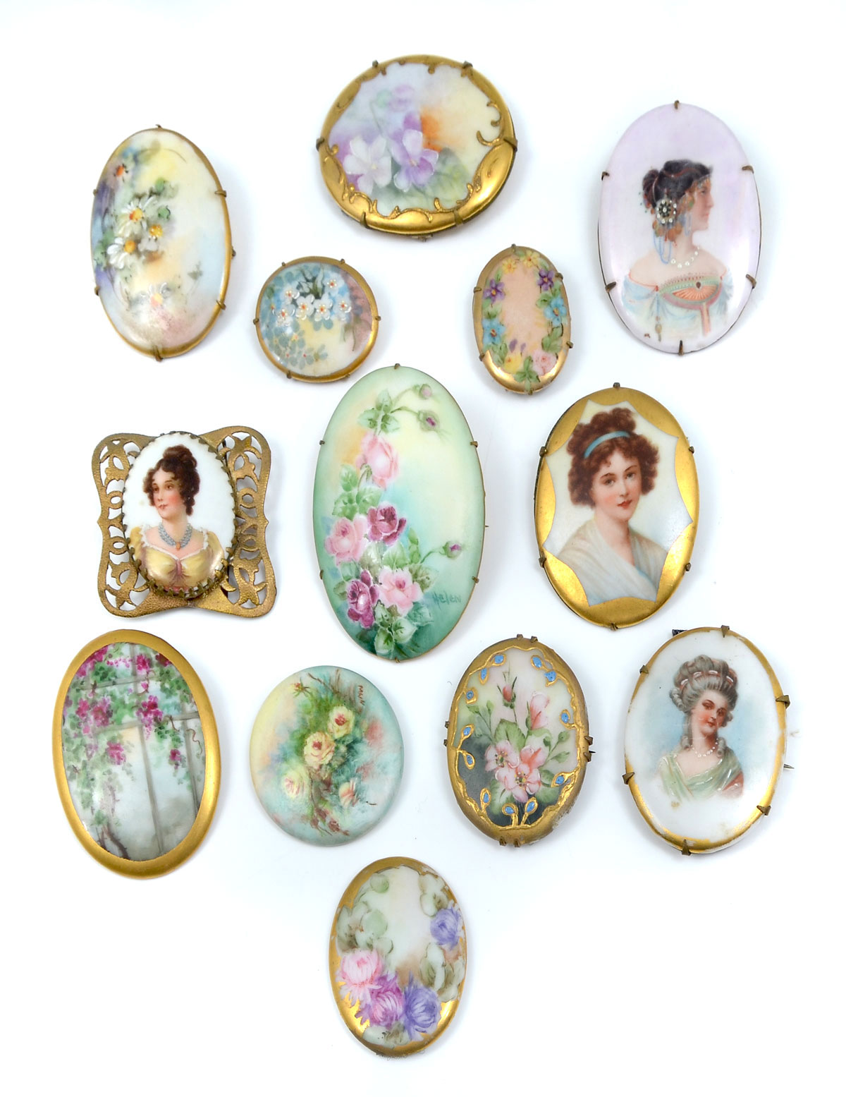 Appraisal: PAINTED PORCELAIN BROOCHES brooches depict portraits of young beauties and