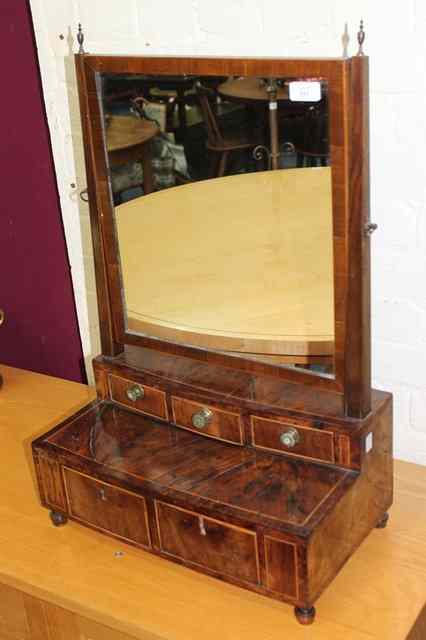 Appraisal: AN ANTIQUE WALNUT DRESSING TABLE MIRROR on a stepped box