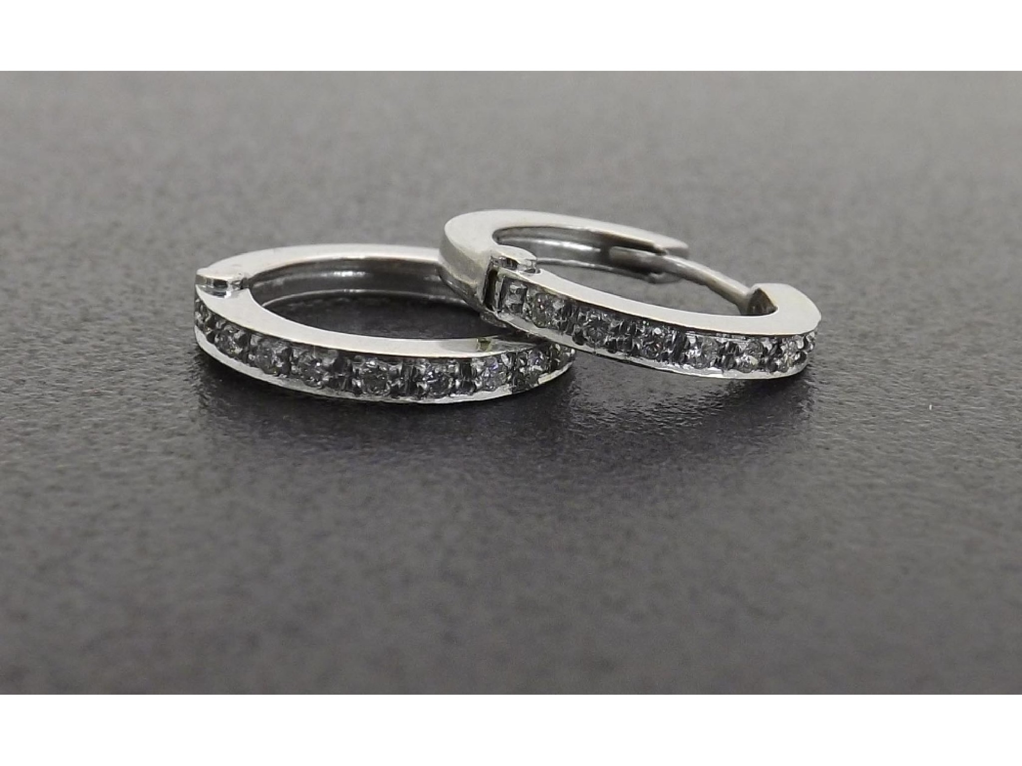 Appraisal: Pair of k white gold diamond hoop earrings gm mm