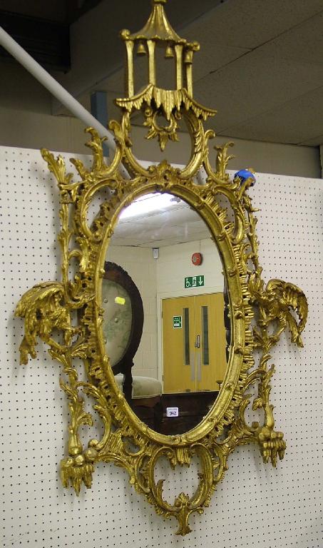 Appraisal: Impressive Italian Florentine style giltwood oval wall mirror the surround