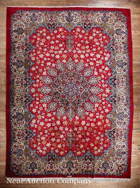 Appraisal: A Kashan Carpet signed by weaver crimson ground central radiating