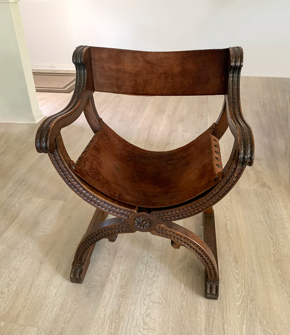 Appraisal: CARVED OAK SAVONAROLA CHAIR Savonarola chair of oak having a