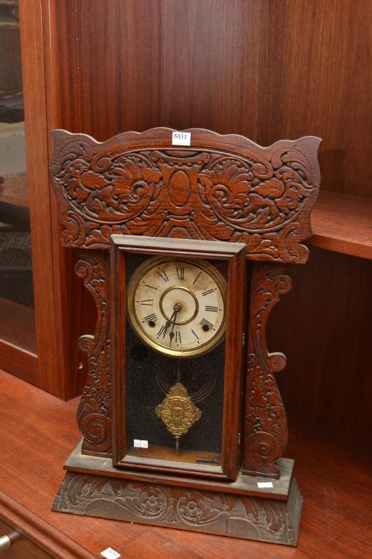 Appraisal: A TIMBER CASED COTTAGE CLOCK A TIMBER CASED COTTAGE CLOCK