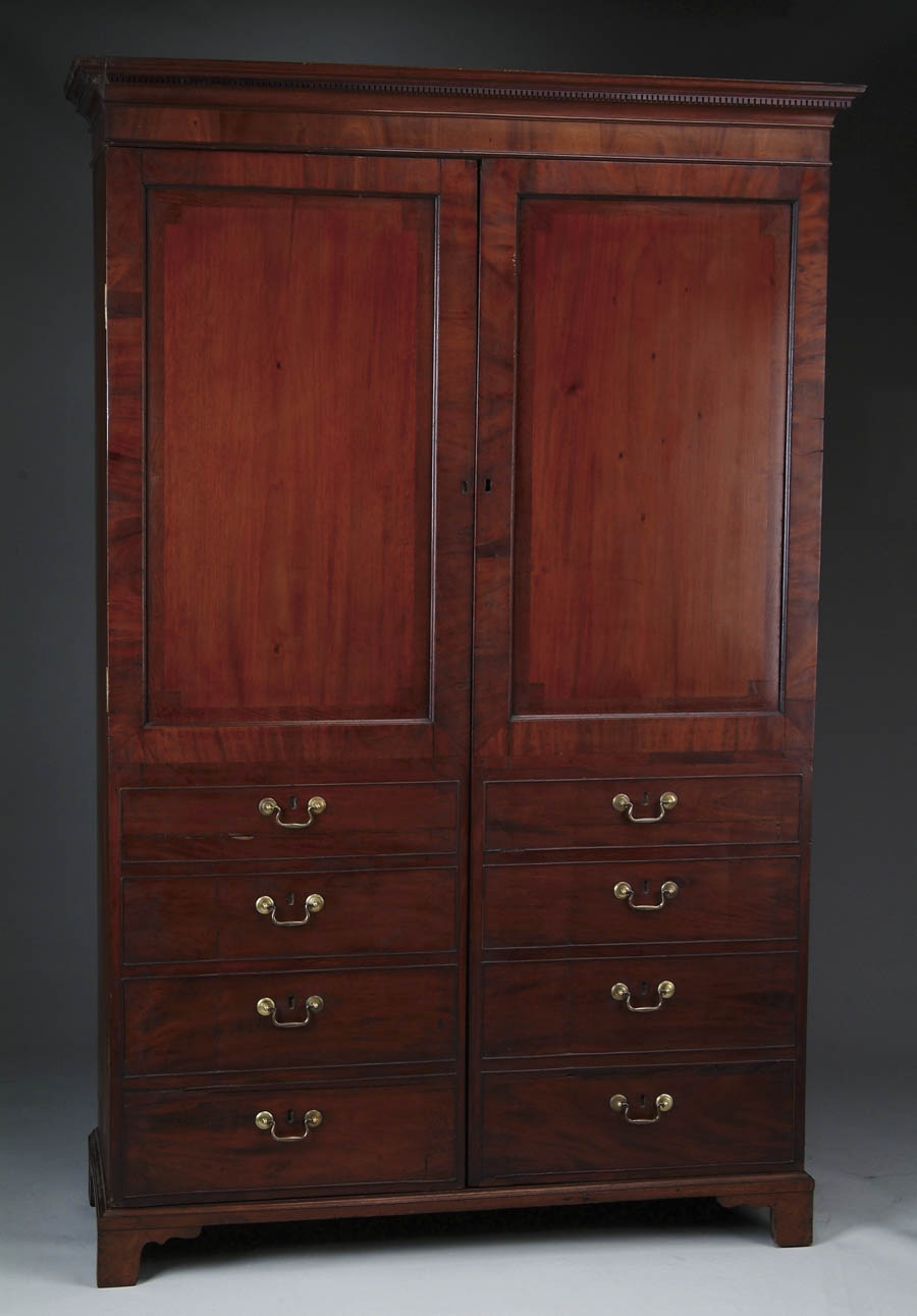 Appraisal: CHIPPENDALE GEORGE III PERIOD MAHOGANY CARVED WARDROBE Three part wardrobe