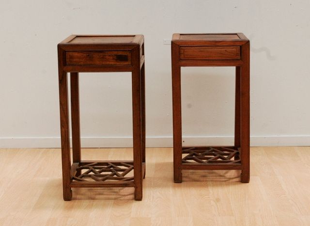 Appraisal: A pair of elm Chinese tea tables each with concealed