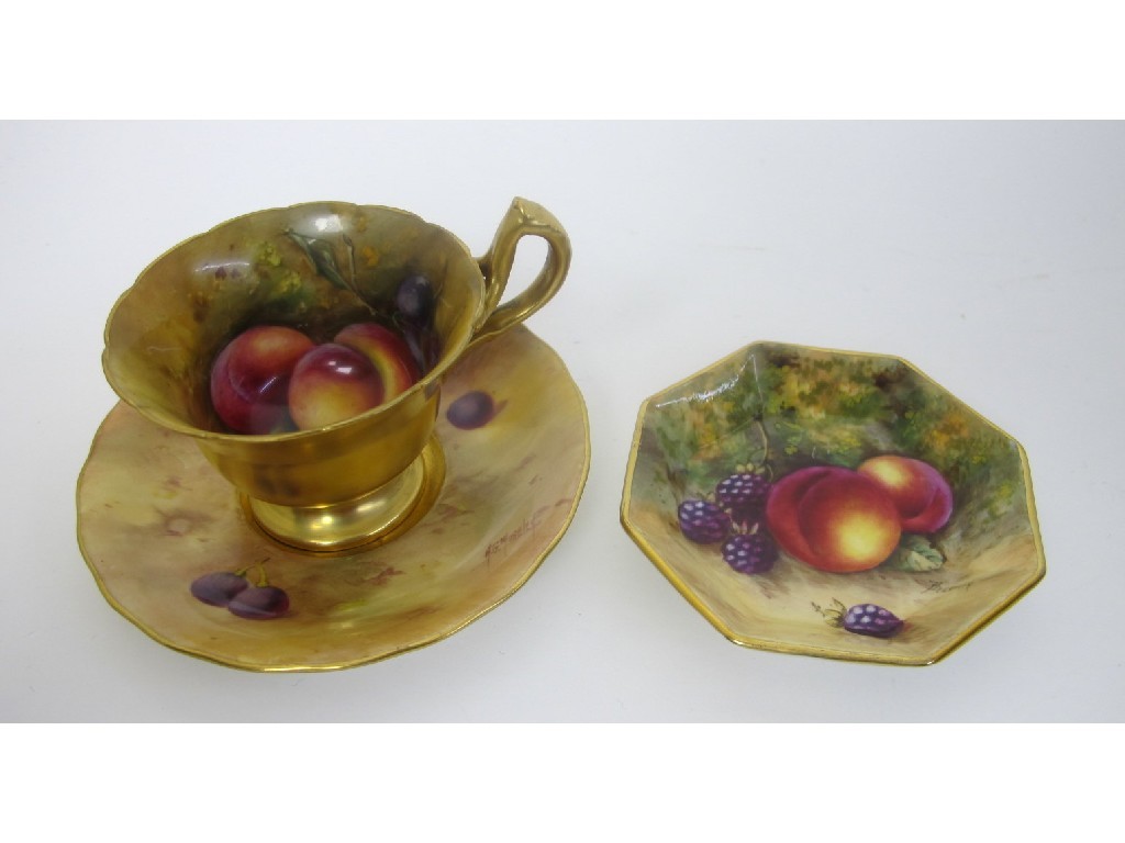 Appraisal: A Royal Worcester cup and saucer painted with peaches and