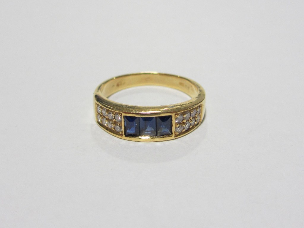 Appraisal: Eighteen carat gold sapphire and diamond half hoop ring