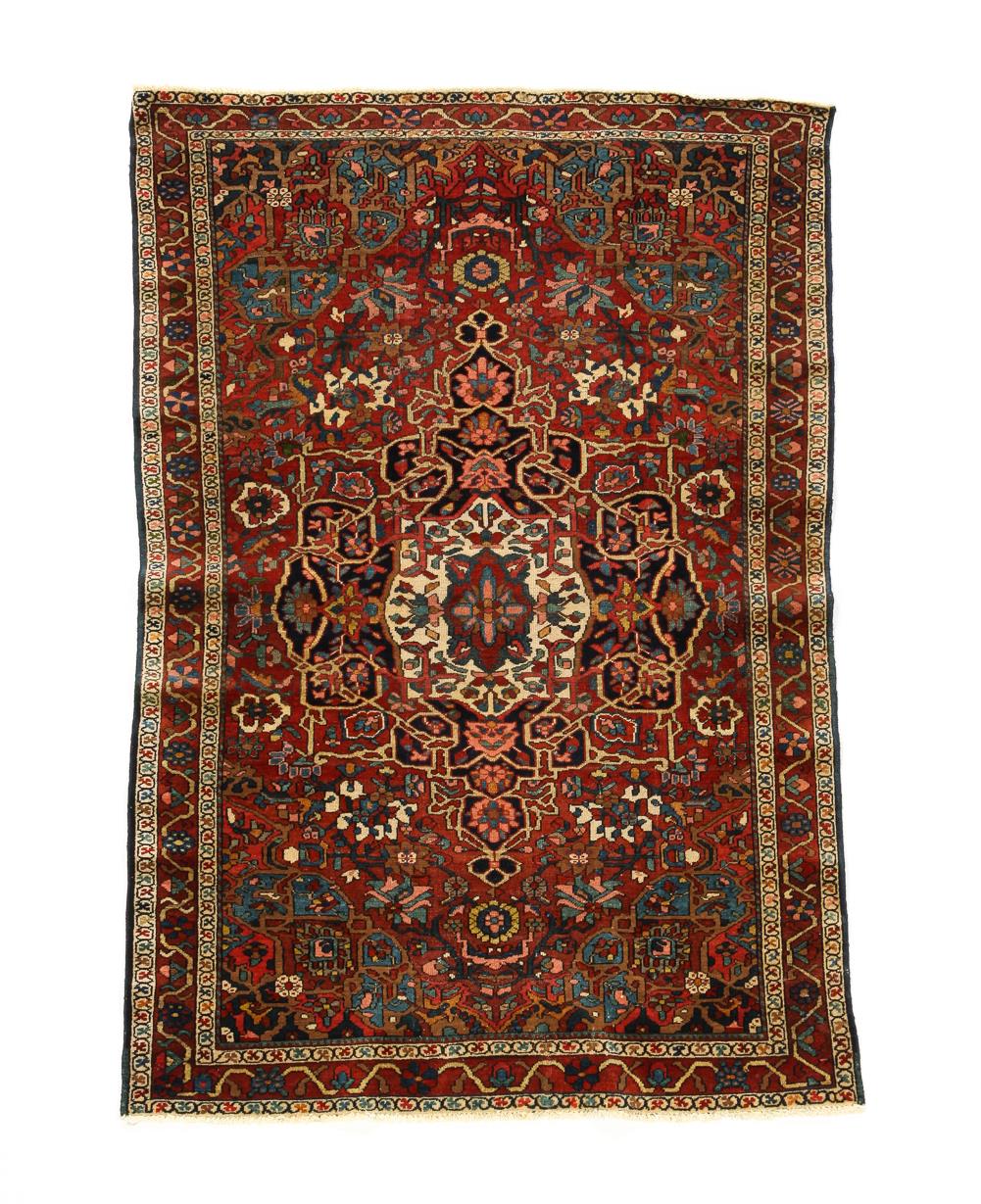 Appraisal: PERSIAN BAKHTIARI RUG Ca Medallion on cotton foundation red field