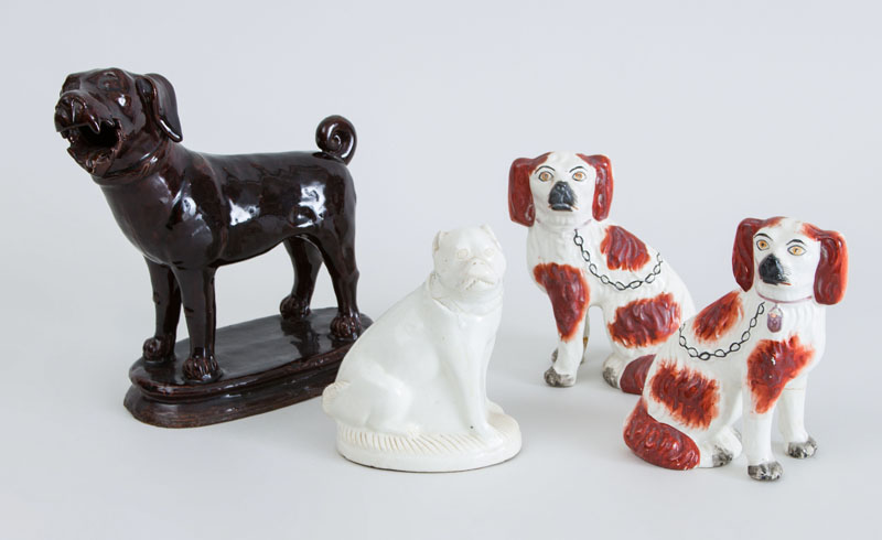 Appraisal: BROWN-GLAZED POTTERY FIGURE OF A HOUND AN ASSEMBLED PAIR OF