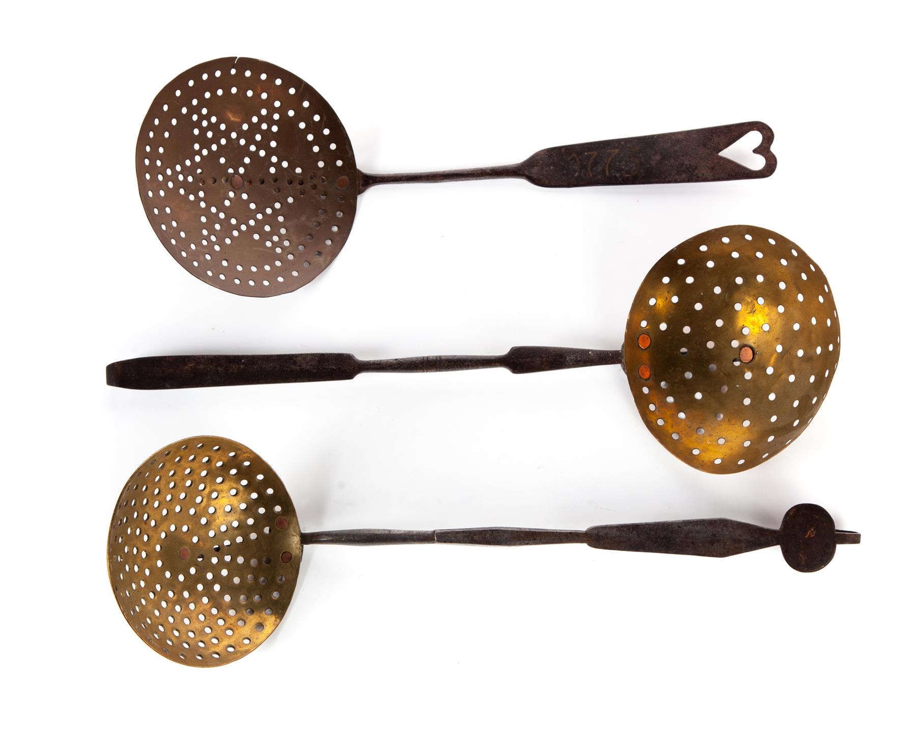 Appraisal: THREE AMERICAN STRAINERS Nineteenth century Brass strainers with wrought iron