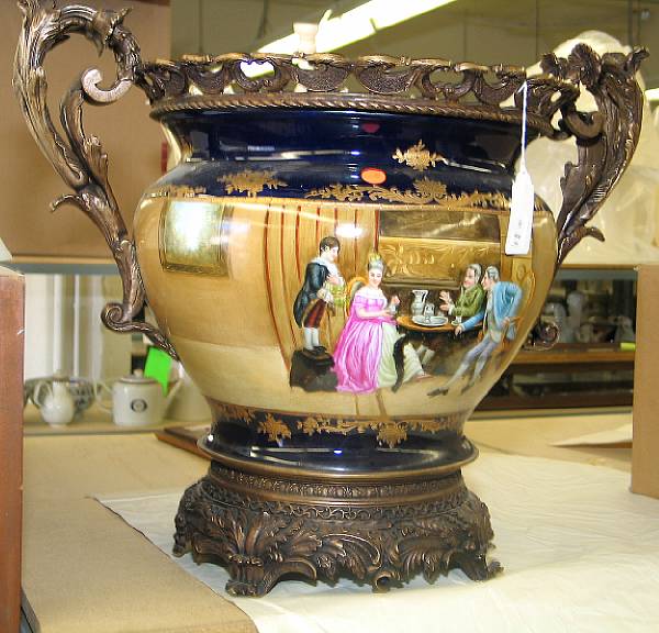 Appraisal: A Sevres style patinated brass mounted porcelain two-handled jardiniere modern