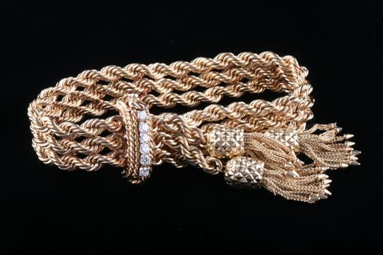 Appraisal: K YELLOW GOLD AND DIAMOND FLEXIBLE TRIPLE-ROPE BRACELET Three matched