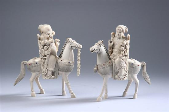 Appraisal: PAIR CHINESE CARVED IVORY EQUESTRIAN FIGURES - in high