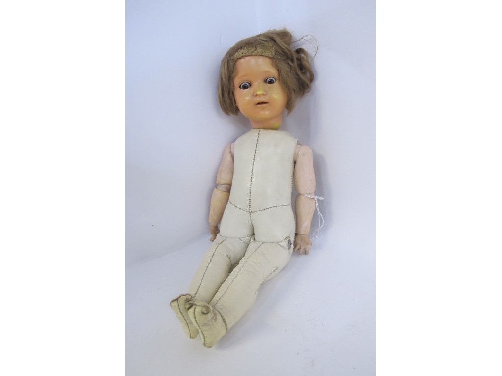 Appraisal: Stuffed leather bodied girl doll