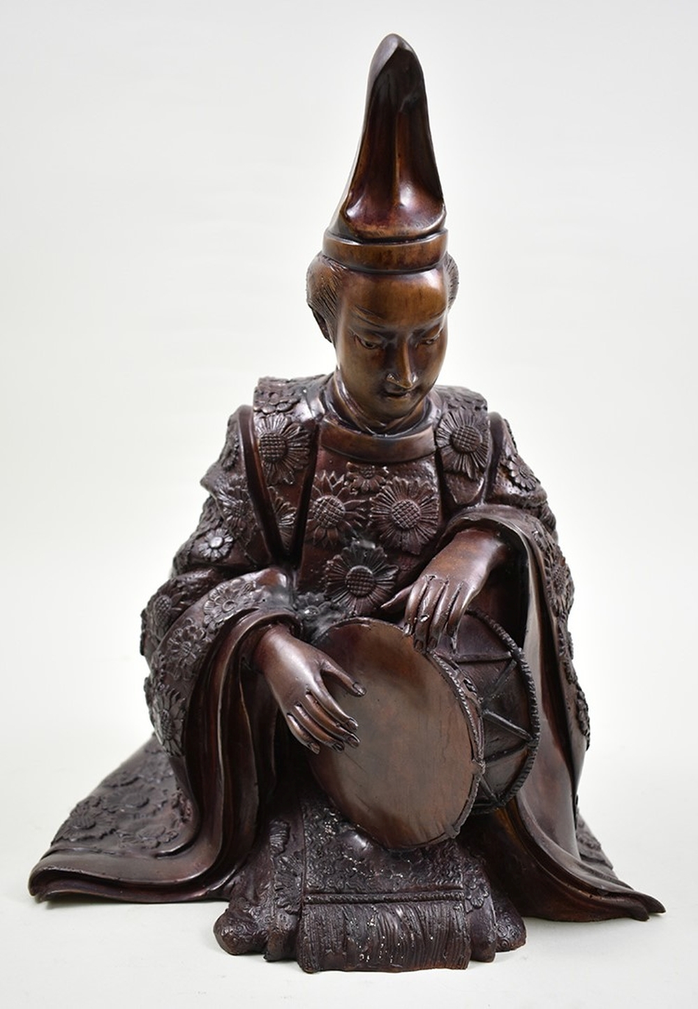 Appraisal: JAPANESE PATINATED BRONZE FIGURE OF A DRUMMERThe figure in a