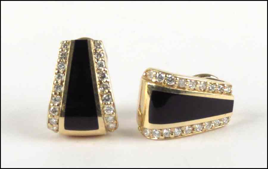 Appraisal: PAIR OF DIAMOND ONYX AND KARAT YELLOW GOLD CLIP POST