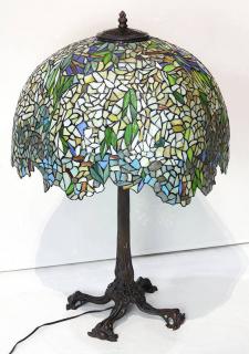 Appraisal: Tiffany style Wysteria leaded glass and patinated bronze table lamp