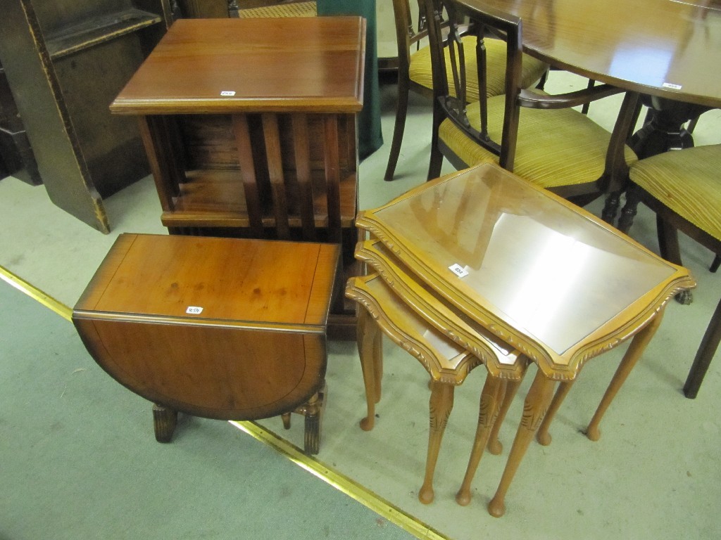 Appraisal: Reproduction revolving bookcase yew wood drop leaf table and a