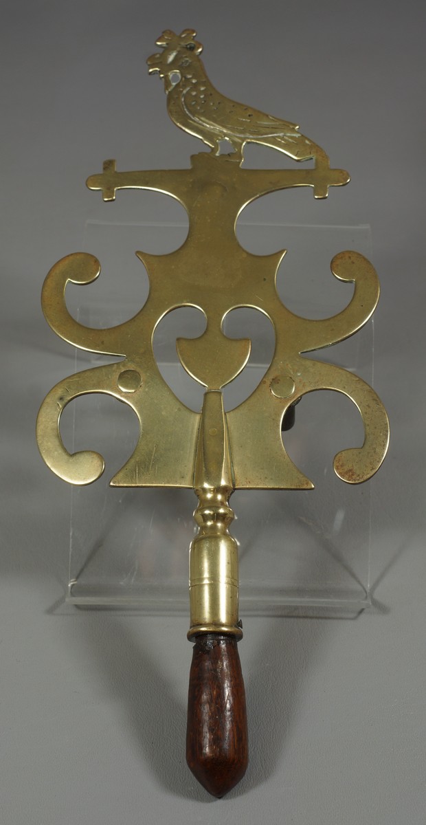 Appraisal: English Brass Trivet with wooden handle bird and heart decoration