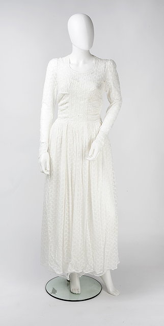 Appraisal: A wedding dress of floral embroidered design with ruched bodice