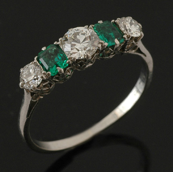 Appraisal: A five stone emerald and diamond ring The half hoop