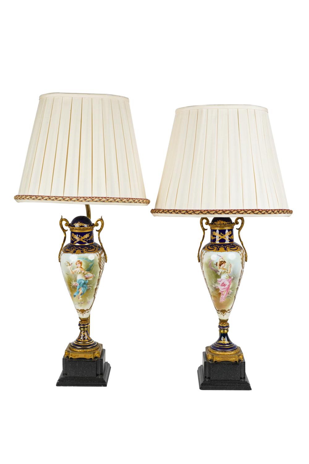 Appraisal: PAIR OF GILT METAL-MOUNTED PORCELAIN TABLE LAMPScobalt and painted porcelain