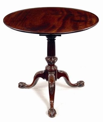 Appraisal: An early George III mahogany tripod table the circular dished