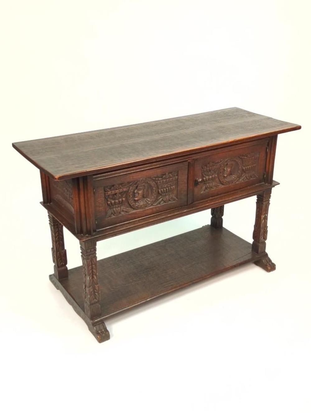 Appraisal: JACOBEAN CONSOLE CABINET WITH TWO DRAWERS CARVED FIGURAL MEDALLION AND