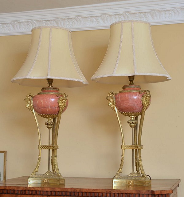 Appraisal: A PAIR OF MARBLE CASSOLETTE STYLE LAMP BASES with ram's