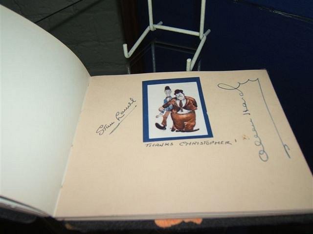 Appraisal: An autograph book to include autographs by Laurel Hardy