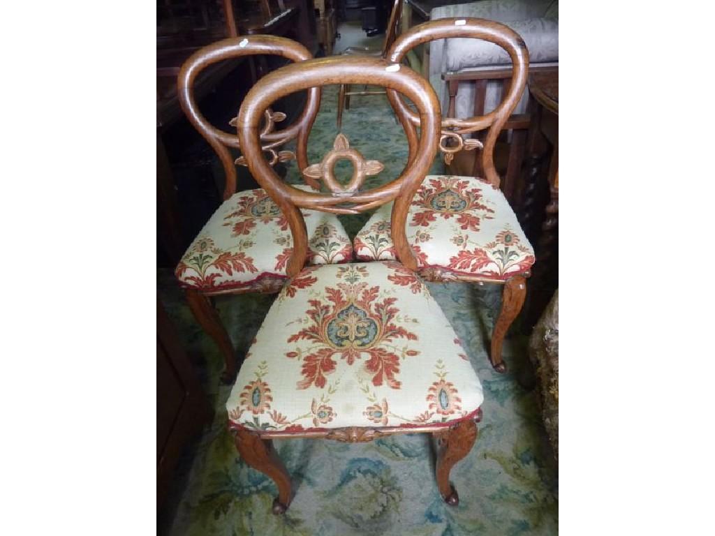 Appraisal: A set of three Victorian oak balloonback dining chairs carved