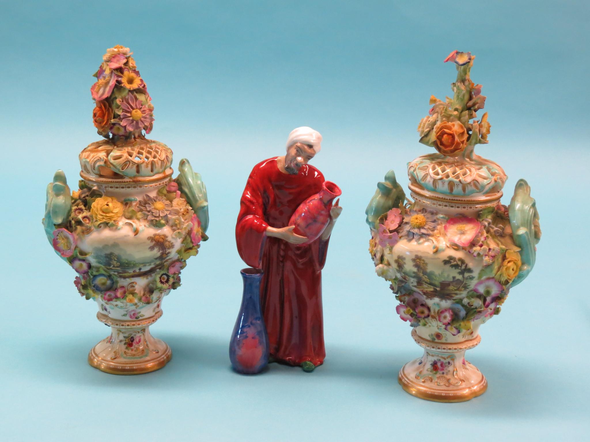 Appraisal: A pair of th century porcelain vases brightly floral-encrusted and