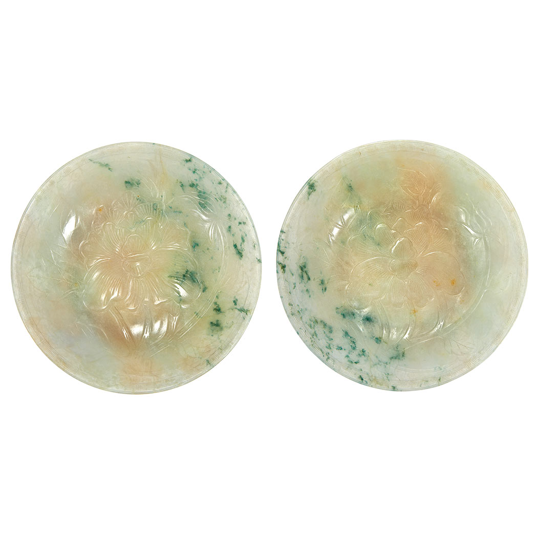 Appraisal: Pair of Chinese Jadeite Dishes Each carved on the interior