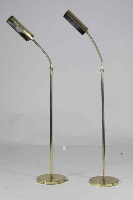 Appraisal: A pair of brass adjustable standard lamps approximately cm high