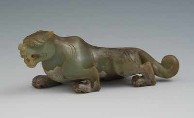 Appraisal: A Carved Jade Tiger Figure Olive green and grayish brown