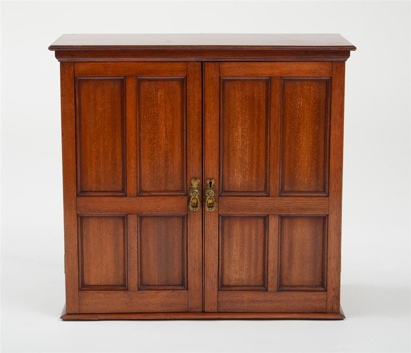 Appraisal: VICTORIAN MAHOGANY TWO-DRAWER TABLE CABINET The overhanging top above a