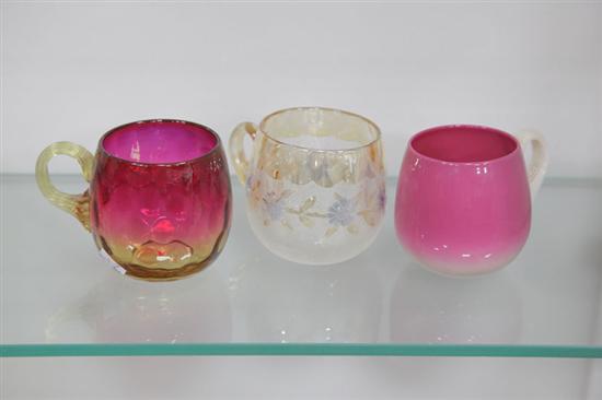 Appraisal: THREE ART GLASS PUNCH CUPS All with applied handles Pamona