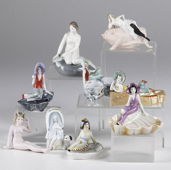 Appraisal: PORCELAIN FIGURES Nine pieces include two nudes reclining woman on