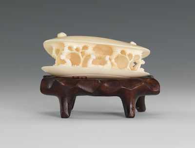 Appraisal: A Carved Ivory Anabori Netsuke In the shape of a