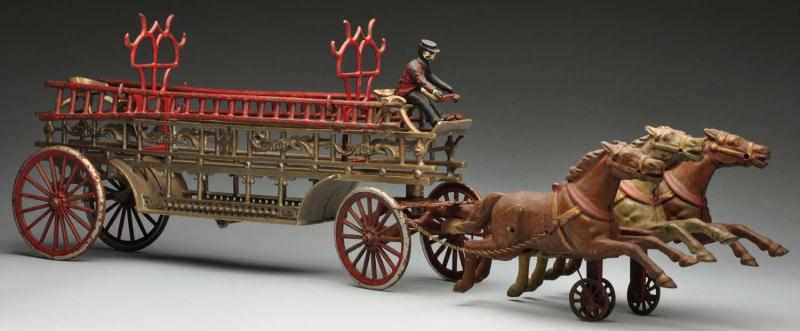 Appraisal: Cast Iron Dent Ladder Truck Horse-Drawn Toy Description American With