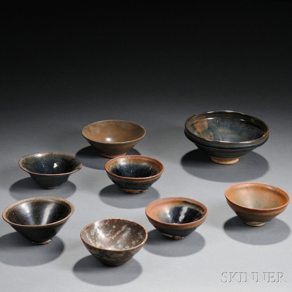 Appraisal: Eight Tenmouku Black-glazed Bowls China some with splashes of green