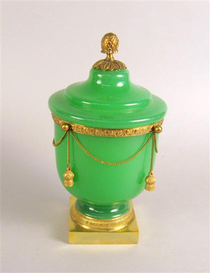 Appraisal: Gilt metal mounted green opaline glass covered urn The cover