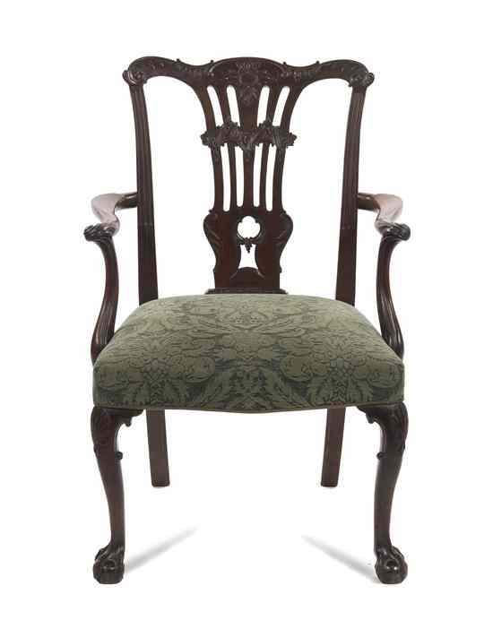 Appraisal: A Chippendale Mahogany Open Armchair having a shaped carved foliate