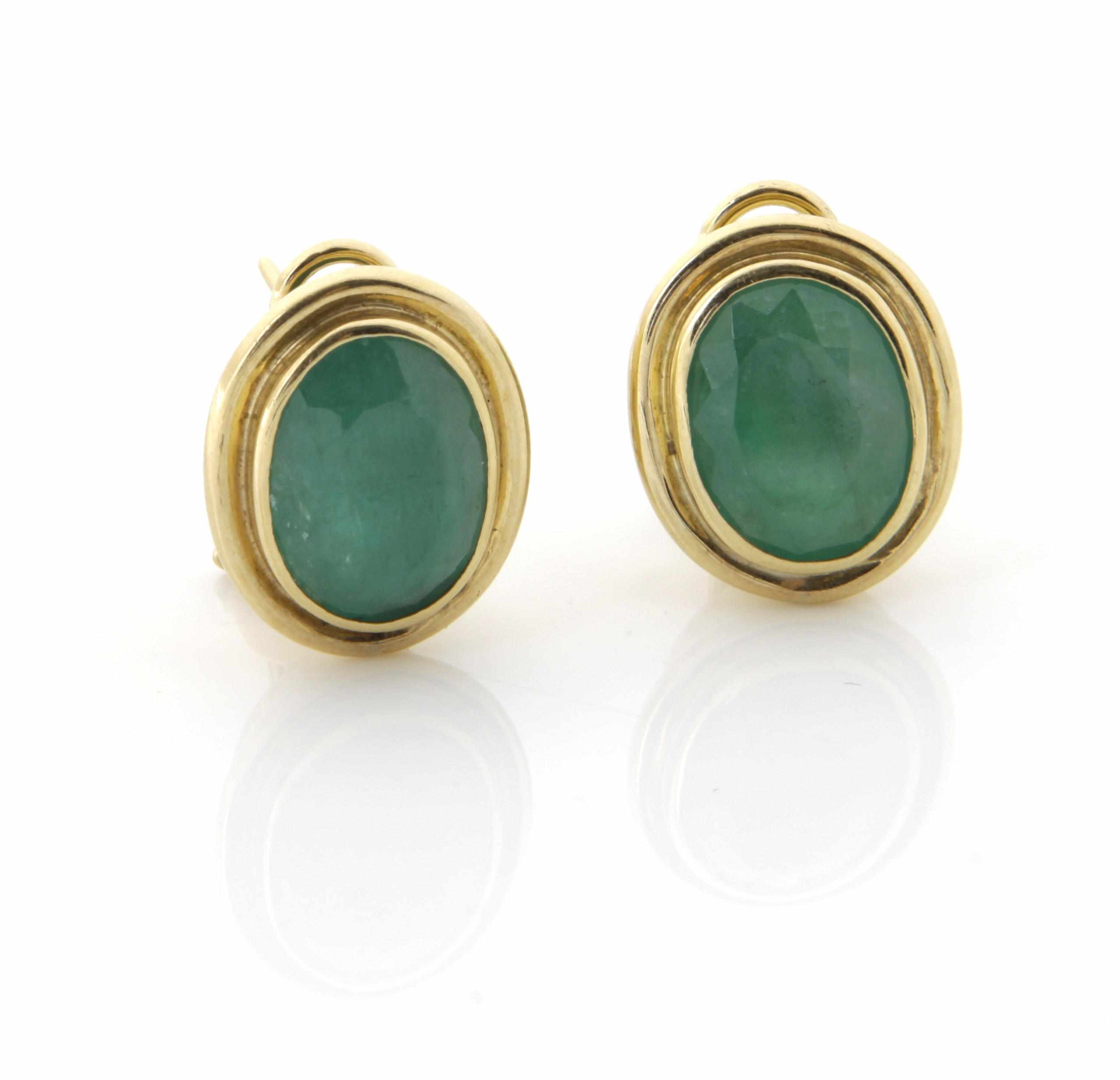 Appraisal: A pair of emerald and gold oval-shaped earrings