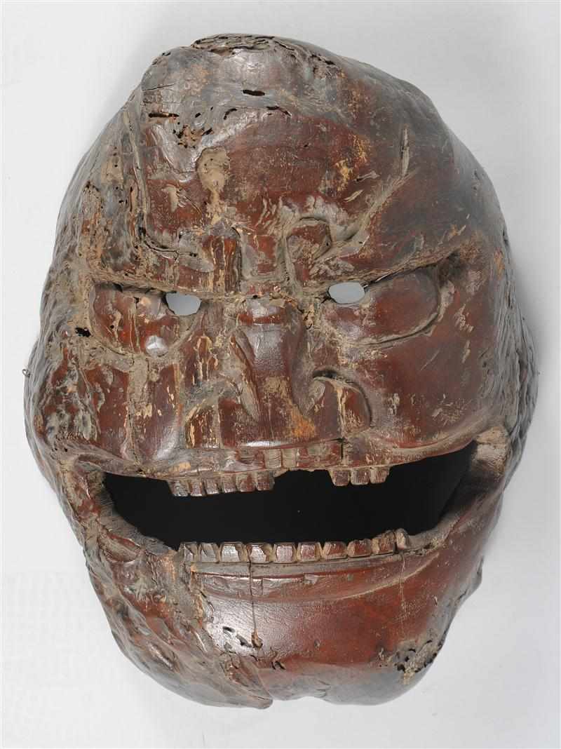 Appraisal: ASIAN SCHOOL GROTESQUE OVERSCALED CEREMONIAL MASK OF GRINNING MAN Carved