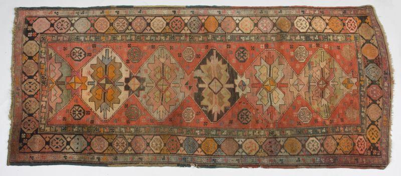 Appraisal: Semi-Antique Persian Runner with medallions on a red field and