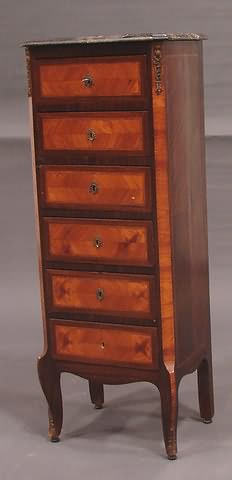 Appraisal: Black marble top exotic wood six drawers with dark borders